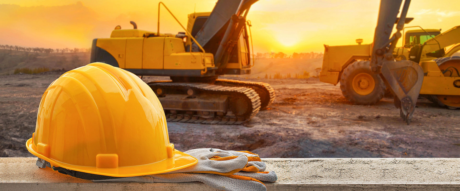 construction site background with hard hat and gloves